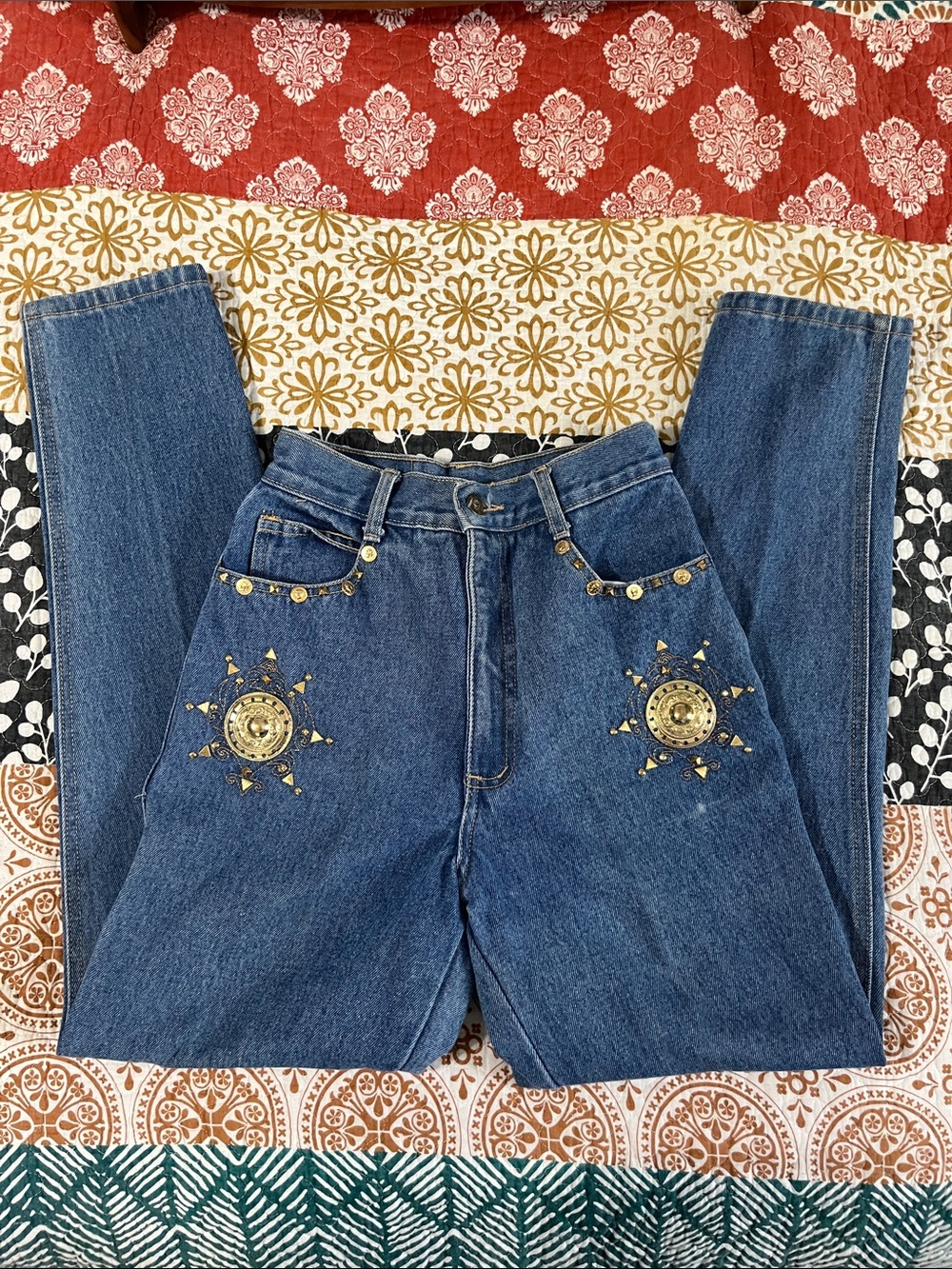 High-Rise Blue Women’s Jeans with Gold Sunburst Embellishments